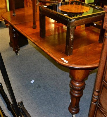 Lot 1250 - A Victorian mahogany dining table with leaf and winder