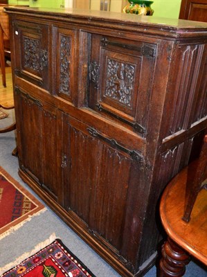 Lot 1253 - A Continental linen fold oak court cupboard