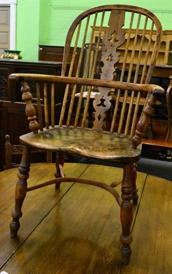 Lot 1257 - A yew and elm Windsor chair with crinoline stretcher