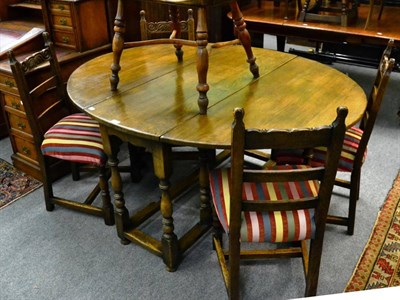 Lot 1258 - A Titchmarsh & Goodwin oak gateleg table and four chairs