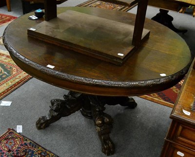 Lot 1259 - A Victorian oak breakfast table with dragon carved legs