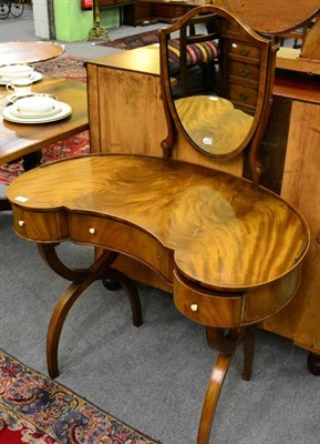 Lot 1262 - A 19th century mahogany dressing table with a reniform top and a shield swivel 20th century...