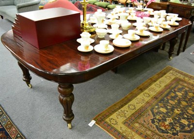 Lot 1273 - A Victorian four leaf wind out dining table