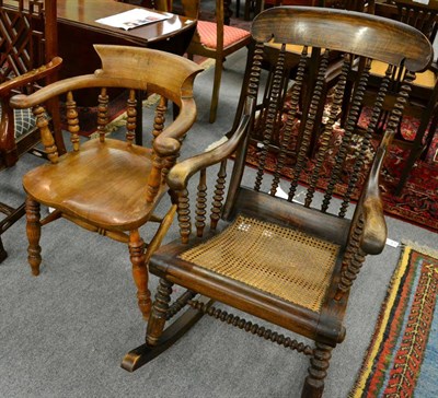 Lot 1289 - A cane seated rocking chair together with an elm smokers chair