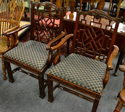 Lot 1290 - A pair of reproduction Chinese Chippendale style chairs with cockpen backs