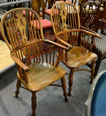 Lot 1291 - A pair of yew and elm Windsor chairs with crinoline stretchers