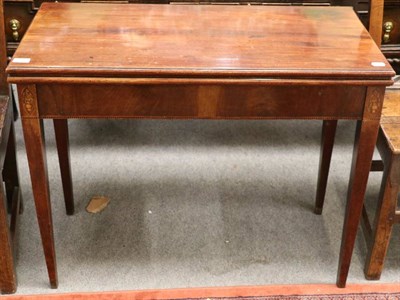 Lot 1294 - An early 19th century mahogany inlaid tea table