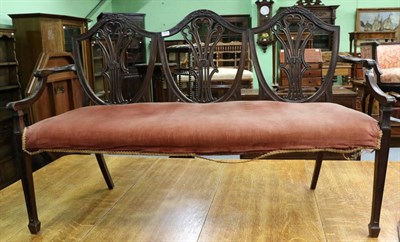 Lot 1297 - A mahogany shield back sofa (a.f.)