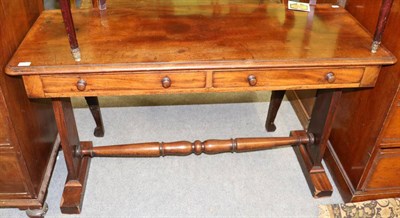 Lot 1306 - A two drawer writing table, circa 1840