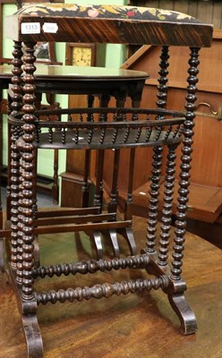 Lot 1313 - A 19th century bobbin turned embroidery stand with needlework top and basket interior