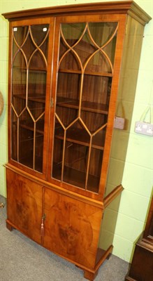 Lot 1329 - A reproduction glazed bookcase