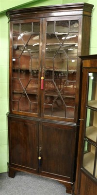 Lot 1330 - A large mahogany astragal glazed standing corner cupboard