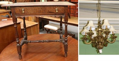 Lot 1346 - An 18th century oak side table and a brass six light chandelier