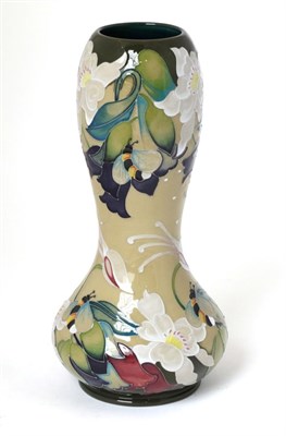 Lot 4 - A Moorcroft pottery vase by Emma Bossons in the Honeywort pattern, 107/150, with painted and...