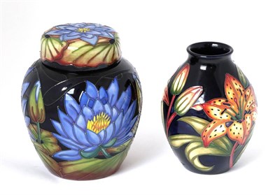 Lot 18 - A Moorcroft pottery ginger jar and cover by Rachel Bishop in the Blue Lotus pattern, with...