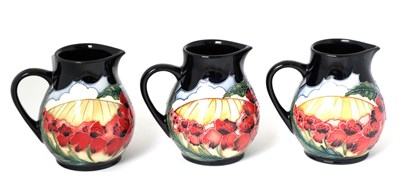 Lot 40 - A set of three Moorcroft pottery jugs by Vicky Lovatt in the Forever England pattern, with...