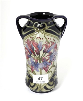 Lot 47 - A Moorcroft pottery twin handled vase by Kerry Goodwin, with painted and impressed marks, 18.5cm