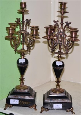 Lot 153 - A pair of black slate and marble gilt metal mounted five light candelabra