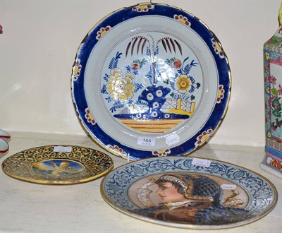 Lot 155 - A 19th century Delft charger, an Italian cabinet plate and a continental plate decorated in relief