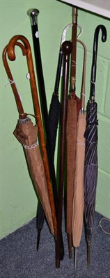 Lot 157 - Lignum Vitae walking cane; a silver mounted cane; a 1930s parasol with horn handle and woven cover