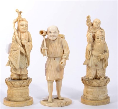 Lot 171 - A pair of 19th century Japanese sectional ivory figures of deities and another of a peasant