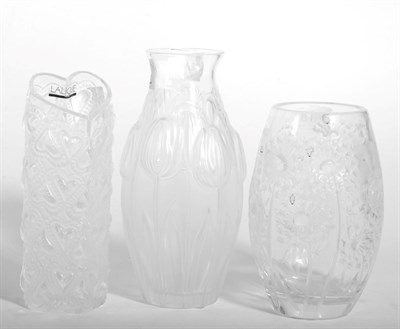 Lot 195 - Three modern Lalique vases, one decorated with tulips, one with dandelions and the other with...