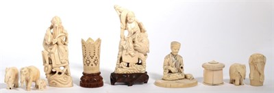 Lot 203 - A pair of Japanese sectional ivory deities, a seated figure, five Indian elephants, a small...