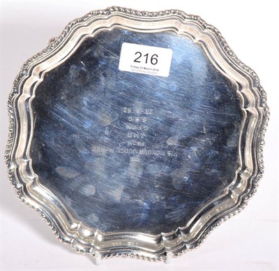 Lot 216 - A shaped circular silver salver or card tray, Stower & Wragg, Sheffield 1942, with gadroon...