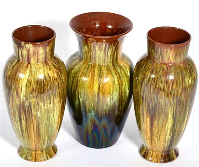 Lot 228 - Three Linthorpe pottery vases: a pair, numbers 876, each with impressed marks and number 491...