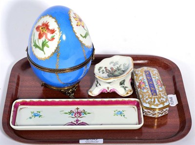 Lot 230 - A Limoges gilt metal mounted porcelain egg form hinged box painted with floral vignettes, a Meissen