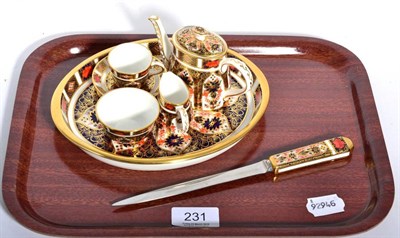 Lot 231 - A Royal Crown Derby miniature Imari carousel and a similar paper knife