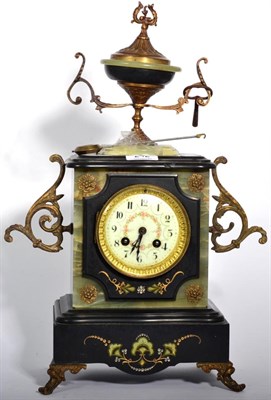 Lot 242 - A Victorian onyx and slate striking mantle clock with urn surmount