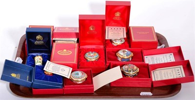 Lot 253 - A collection of twelve Halcyon Days enamel trinket boxes comprising a year run of Christmas...