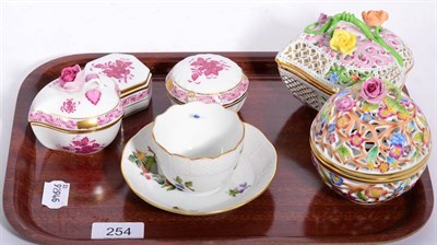 Lot 254 - Herend porcelain; two pierced floral encrusted covered boxes, tea cup and saucer and three...