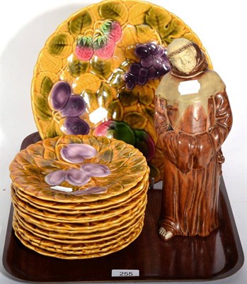 Lot 255 - A French part dessert service decorated with fruit and a pottery decanter in the form of a monk