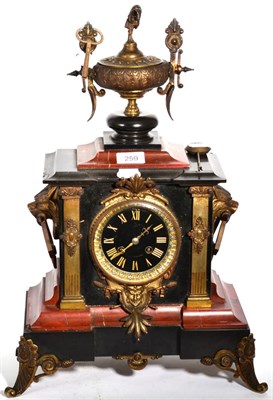 Lot 259 - A Victorian red marble and black slate striking mantel clock