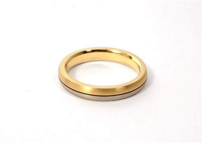 Lot 274 - An 18 carat two colour gold matt polished band ring, finger size T