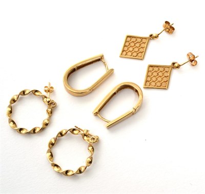 Lot 275 - Three pairs of 9 carat gold earrings, comprising twisted hoop earrings, another pair of hoop...