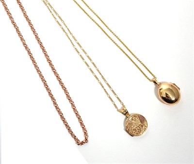 Lot 276 - A 9 carat gold chased locket pendant on a 9 carat gold figaro link chain, locket measures 2cm...