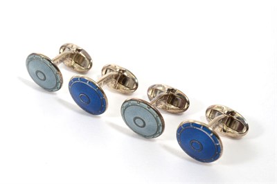 Lot 277 - A pair of silver blue guilloche enamel cufflinks, circular heads to hinged solid bars and a...