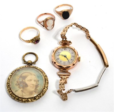 Lot 298 - A 9 carat gold lady's wristwatch; a signet ring; a cameo ring; a dress ring; and a locket (5)