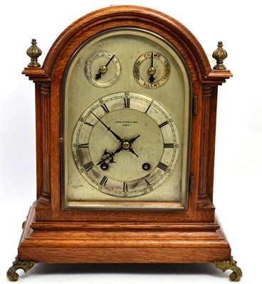 Lot 336 - An oak quarter striking mantel clock, retailed by John Dyson &amp; Sons, Leeds, ting tang...