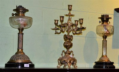 Lot 376 - Two Victorian brass oil lamps and a 19th century five light bronze candelabra