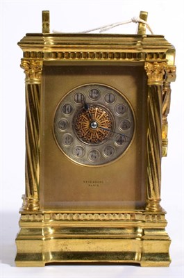 Lot 380 - A brass striking carriage clock, dial signed Reid & Sons, Paris, the case with spirally fluted...