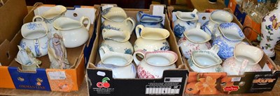 Lot 1007 - A collection of fifteen Continental transfer printed wash jugs; and two bisque porcelain...