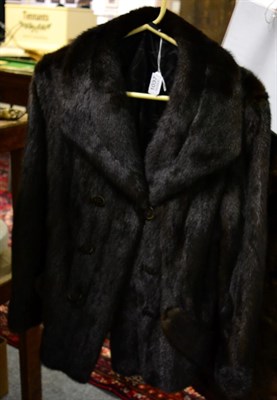 Lot 1037 - Short dark mink fur jacket, with slanting pockets to the front, single breasted