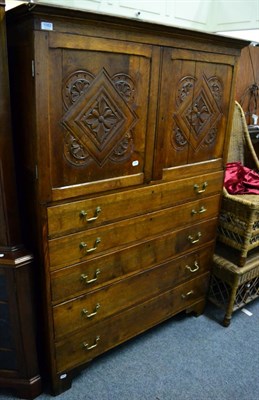 Lot 1082 - An 18th century oak linen press of small proportions, integral cornice above two carved...