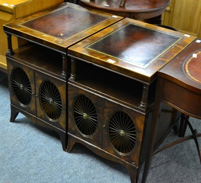 Lot 1090 - A pair of leather inset mahogany side tables