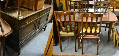 Lot 1100 - An oak dining suite comprising, a dining table, four chairs, a sideboard (6)