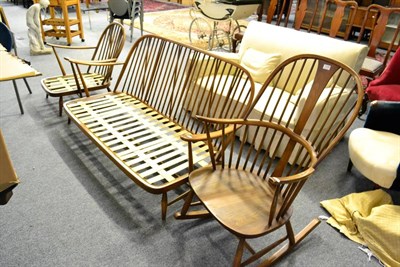 Lot 1109 - An Ercol elm settee together with a matching low chair and an Ercol rocking chair